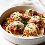 Baked Chicken Parmesan Meatballs with Roasted Garlic Spaghetti