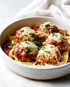 Baked Chicken Parmesan Meatballs with Roasted Garlic Spaghetti